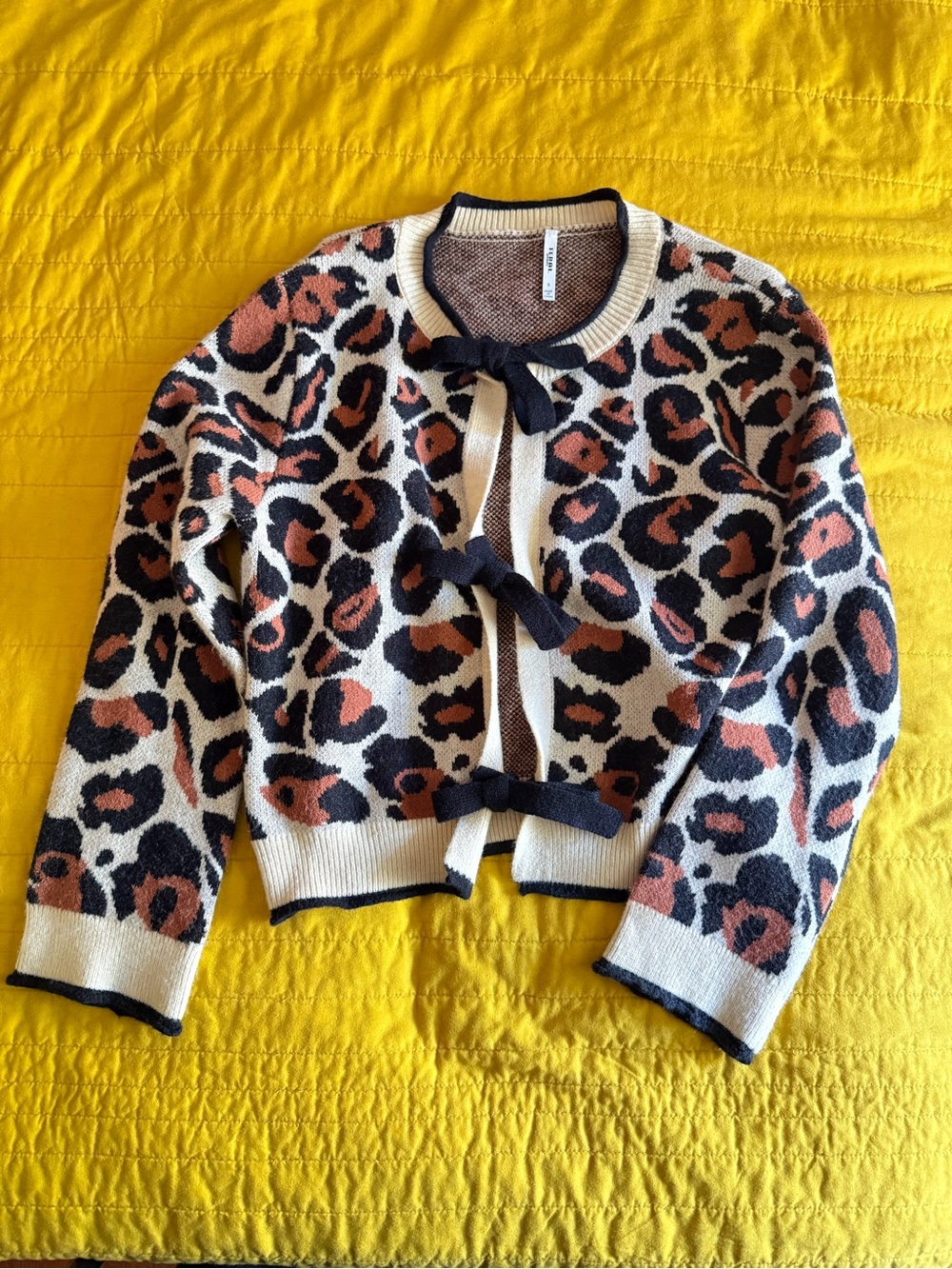 Feral Apparel Leopard Print Bow-Front Cardigan in Cream, Black & Rust
